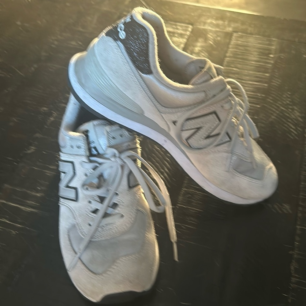 Previously owned new balance 574’s color gray with satin and black.